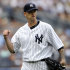 New York Yankees pitcher A.J. Burnett reacts during the seventh inning of the first game of a baseball doubleheader against the Boston Red Sox, Sunday, Sept. 25, 2011, at Yankee Stadium in New York. Burnett got the win as the Yankees defeated the Red Sox 6-2. (AP Photo/Bill Kostroun)