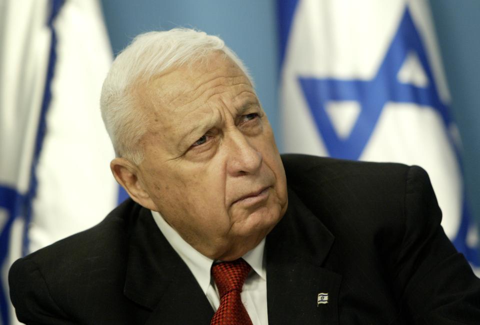 FILE - In this Sunday May 16, 2004 file photo, Israeli Prime Minister Ariel Sharon pauses during a news conference in his Jerusalem office regarding education reform. Israeli media outlets are reporting that Sharon has died Saturday, Jan. 11, 2014 at the age of 85. (AP Photo/Oded Balilty, File)