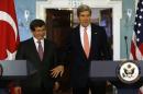U.S. Secretary of State Kerry and Turkish Foreign Minister Davutoglu arrive to speak to reporters at State Department in Washington
