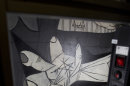 A camera mounted on a mobile robot-like structure moves across Pablo Picasso's 'Guernica' painting at the Reina Sofia Museum in Madrid Tuesday Feb. 21, 2012. Experts have long been concerned about the health of Picasso's 