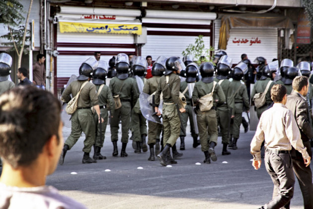 In this Saturday, Aug. 27, 2011 photo, obtained by the Associated Press outside Iran shows riot police officers taking position during a protest, at the northwestern city of Oroumieh, Iran. Protesters