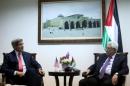 Palestinian president Mahmud Abbas ® meets with US Secretary of State John Kerry in the West Bank city of Ramallah on December 12, 2013