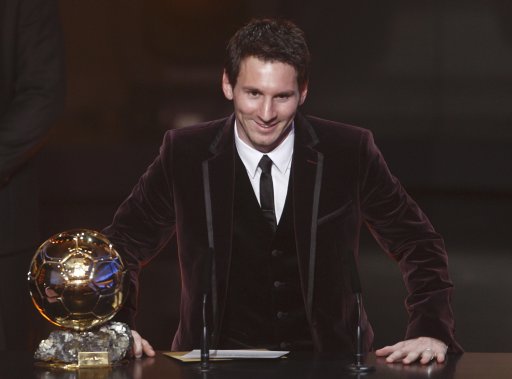 Messi of Argentina, FIFA World Player of the Year poses next to his FIFA Ballon d'Or 2011 trophy during the FIFA Ballon d'Or 2011 soccer awards ceremony in Zurich
