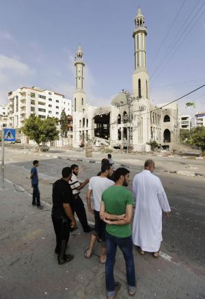 Palestinians inspect the damage at the Ameen mosque &hellip;