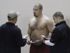 Offensive lineman Lane Johnson talks with NFL scouts during Oklahoma's NFL football pro day in Norman, Okla., Wednesday, March 13, 2013. (AP Photo/Alonzo Adams)