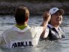 Inbee Park, right, of South Korea, celebrates after jumping into Poppy's Pond with caddie Brad Beecher after winning the LPGA Kraft Nabisco Championship golf tournament in Rancho Mirage, Calif., Sunday, April 7, 2013. (AP Photo/Chris Carlson)