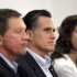 Republican presidential candidate, former Massachusetts Gov. Mitt Romney, accompanied by Ohio Gov. John Kasich, left, and student Kelsey Gorman, listens during a roundtable discussion at Otterbein University in Westerville, Ohio, Friday, April 27, 2012. (AP Photo/Jae C. Hong)