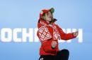 Women's biathlon 15K individual gold medalist Darya Domracheva of Belarus celebrates during the medals ceremony at the 2014 Winter Olympics, Saturday, Feb. 15, 2014, in Sochi, Russia. (AP Photo/David J. Phillip )