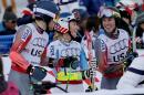 United States' Mikaela Shiffrin, center, talks with United State's Ted Ligety and United States' David Chodounsky during the mixed worlds team skiing event at the alpine skiing world championships, Tuesday, Feb. 10, 2015, in Vail, Colo. (AP Photo/Marco Trovati)