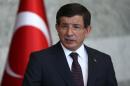 Turkey's Prime Minister Ahmet Davutoglu gives a statement on the situation with the Islamic State and other militant groups during a press conference in Ankara on July 24, 2015