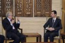 Syria's President Bashar al-Assad meets International peace envoy for Syria Lakhdar Brahimi in Damascus
