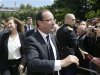 France's President Hollande and his companion Trierweiler shake hands with visitors in the gardens of the Elysee Palace in Paris