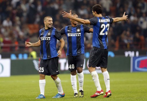 Inter Milan's Samuel, Jesus and Ranocchia celebrate after defeating AC Milan in their Italian Serie A soccer match in Milan