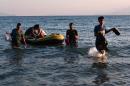 A group of migrants arrives to the shore of Greece's Kos island on a small dinghy from Turkey, on August 18, 2015
