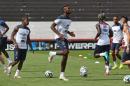 France's Paul Pogba, center, warms up during a training session at Santa Cruz stadium in Ribeirao Preto, Brazil, Saturday, June 28, 2014. France will face Nigeria on Monday in the round of 16 at the World Cup. (AP Photo/David Vincent)