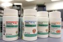 Bottles of cholesterol drug Zocor are shown as Merck announces plans to cut jobs and close factories