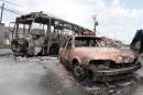 View of a burnt bus and car at Vida Nova bus station, in Campinas, some 96 km from Sao Paulo, Brazil on January 13, 2013
