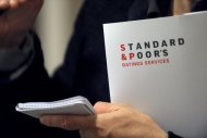 Standard & Poor's held its US sovereign rating steady at AA+ but also kept its negative outlook on the country, citing the political deadlock over fixing the fiscal deficit. (AFP Photo/Eric Piermont)