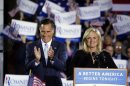 Republican presidential candidate, former Massachusetts Gov. Mitt Romney and wife, Ann, take the stage at an election night rally in Manchester, N.H., Tuesday, April 24, 2012. (AP Photo/Jae C. Hong)