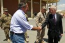 US Secretary of Defense Panetta shakes hands with US Ambassador to Afghanistan Crocker before departing Kabul International Airport