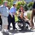 Samantha Yowler is pushed in a wheelchair into the University of Colorado Hospital to meet with President Barack Obama in Aurora