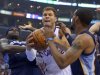Los Angeles Clippers forward Blake Griffin, middle, drives between Memphis Grizzlies forward Zach Randolph, left, and Mike Conley during the first half of Game 2 of a first-round NBA basketball playoff series, Monday, April 22, 2013, in Los Angeles.  (AP Photo/Mark J. Terrill)
