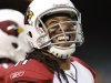In this photo taken Aug. 11, 2011, Arizona Cardinals wide receiver Larry Fitzgerald (11) smiles in the first quarter of an NFL preseason football game against the Oakland Raiders in Oakland, Calif. The  Cardinals and Fitzgerald have agreed to an eight-year deal that could pay the star receiver as much as $120 million, making it one of the richest deals in the NFL. (AP Photo/Marcio Jose Sanchez)