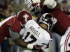 Mississippi State quarterback Dak Prescott (15) is sacked by Alabama linebacker Denzel Devall (30) and defensive lineman Quinton Dial (90) during the first half of an NCAA college football game at Bryant-Denny Stadium in Tuscaloosa, Ala., Saturday, Oct. 27, 2012. (AP Photo/Dave Martin)