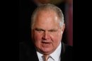 FILE - In this Jan. 13, 2009 file photo, conservative talk show host Rush Limbaugh talks with guests in the East Room of the White House in Washington. Limbaugh apologized Saturday, March 3, 2012, to a Georgetown University law student he had branded a 