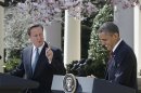 President Barack Obama laughs as British Prime Minister David Cameron makes opening remarks during their joint news conference in the Rose Garden of the White House in Washington, Wednesday, March 14, 2012. (AP Photo/Charles Dharapak)