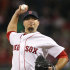 Boston Red Sox starting pitcher Josh Beckett delivers to the Baltimore Orioles in the first inning of a baseball game at Fenway Park in Boston, Wednesday, Sept. 21, 2011. (AP Photo/Elise Amendola)