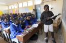 Pupils revise their class work without a teacher during a strike, at Olympic Primary School in Nairobi