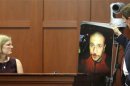 George Zimmerman's physician, Lindzee Folgate, testifies as his attorney Mark O'Mara displays a photo of Zimmerman during George Zimmerman's murder trial in Seminole circuit court in Sanford