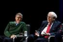 Warren Buffett, chairman and CEO of Berkshire Hathaway, speaks while Bill Gates looks on at Columbia University in New York