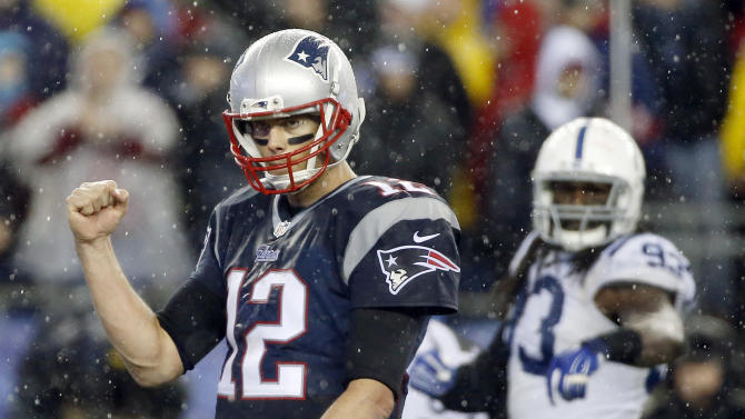 New England Patriots quarterback Tom Brady (12) celebrates LeGarrette Blount&#39;s touchdown during the second half of the NFL football AFC Championship game against the Indianapolis Colts Sunday, Jan. 18, 2015, in Foxborough, Mass
