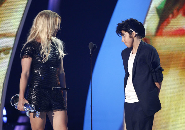 Lady Gaga, right, presents Britney Spears with the Video Vanguard award at the MTV Video Music Awards on Sunday Aug. 28, 2011, in Los Angeles. (AP Photo/Matt Sayles)