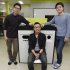 In this Tuesday, May 14, 2013 photo, from left, Ecube Labs CEO Kwon Sunbeom, his co-founders Lee Seungjae and Kwon Hyungsuk pose with their product, a solar energy-powered garbage bin, at their office in Seoul, South Korea. Instead while his peers were seeking jobs at Samsung and LG, Kwon Sunbeom scaled back his studies and started the company with friends. Together they invented the garbage bin that compresses rubbish using solar power and wirelessly communicates to be collected when full. Using 50 million won ($44,000) of their own money and channeling the business in a garage spirit that made Silicon Valley famous, they lived for a month in a shabby factory without air conditioning, subsisting on instant noodles, to make their first prototype. So far they have sold 31 of their “Smart Bins” to universities in Seoul and another 12 to Saudi Arabia and the United Arab Emirates. (AP Photo/Ahn Young-joon)