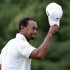 Tiger Woods acknowledges the gallery after putting on the 18th hole during the third round of the U.S. Open golf tournament at Merion Golf Club, Saturday, June 15, 2013, in Ardmore, Pa. (AP Photo/Gene J. Puskar)