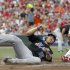 New York Mets' Carlos Beltran, left, slides safely into home plate past Cincinnati Reds catcher Ramon Hernandez, right, after a Jason Bay sacrifice fly during the third inning of a baseball game, Tuesday, July 26, 2011, in Cincinnati. (AP Photo/David Kohl)