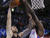 Toronto Raptors center Andrea Bargnani (7) goes up for a basket in front of Oklahoma City Thunder center Kendrick Perkins (5) during the first quarter of an NBA basketball game in Oklahoma City, Tuesday, Nov. 6, 2012. (AP Photo/Alonzo Adams)