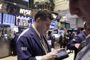 Traders work on the floor of the New York Stock Exchange Tuesday, Feb. 28, 2012. World stock markets fell Thursday March 29, 2012 as signs of weakness in the world's two biggest economies kept investors at bay. (AP Photo/Richard Drew)