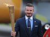 David Beckham carried the Olympic torch in May during the relay through England
