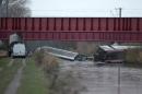 A high-speed train lies in a canal after derailing in Eckwersheim near Strasbourg, northeastern France, on November 14, 2015