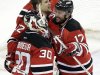 New Jersey Devils' Alexei Ponikarovsky, top, of Ukraine, celebrates his game-winning goal against the Philadelphia Flyers with teammates Ilya Kovalchuk (17), of Russia, and Martin Brodeur (30) in a 4-3 overtime victory in Game 3 of a second-round NHL hockey Stanley Cup playoff series, Thursday, May 3, 2012 in Newark, N.J. The Devils took a 2-1 lead in the series. (AP Photo/Julio Cortez)