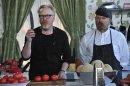 In this undated image released by Discovery Channel, hosts Adam Savage, left, Jamie Hyneman appear in a mock kitchen to introduce teams on Discovery Channel's 