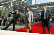 Actress Jane Lynch, left, executive producer Mark Burnett, center, and Academy of Television Arts and Sciences president John Shaffner rollout of the red carpet for the 63rd Primetime Emmy Awards in Los Angeles, Wednesday, Sept. 14, 2011. The Emmy Awards will take place Sunday, Sept. 18 in Los Angeles. (AP Photo/Matt Sayles)