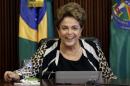 Brazil's President Dilma Rousseff smiles during a meeting with ministers at the Planalto Palace in Brasilia