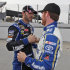 Jimmie Johnson, left, gets a handshake and hug from Brian Vickers, right, after qualifying for Sunday's Sprint Cup race at Martinsville Speedway  in Martinsville, VA., Friday, Oct. 26, 2012.  Johnson won the pole and Vickers was second.  (AP Photo/Steve Helber)
