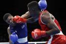 United State's Gary Russell, left, fights Haiti's Haiti's Richardson Hitchins during a men's light welterweight 64-kg preliminary boxing match at the 2016 Summer Olympics in Rio de Janeiro, Brazil, Wednesday, Aug. 10, 2016. (AP Photo/Frank Franklin II)