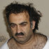 FILE - In this March 1, 2003 file picture, Khalid Sheikh Mohammed is seen shortly after his capture during a raid in Pakistan. A hidden network of American companies headed by a prominent defense contractor played a central role in the CIA’s secret post-9/11 airlift that whisked captured terror suspects and their American minders to overseas prisons, according to testimony and documents filed in an upstate New York court case.  (AP Photo/File)